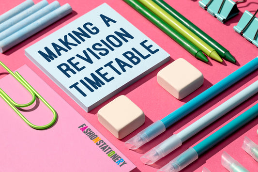 Pictured: Stationery layout on a pink background, with the text Making a Revision Timetable written on a post it note