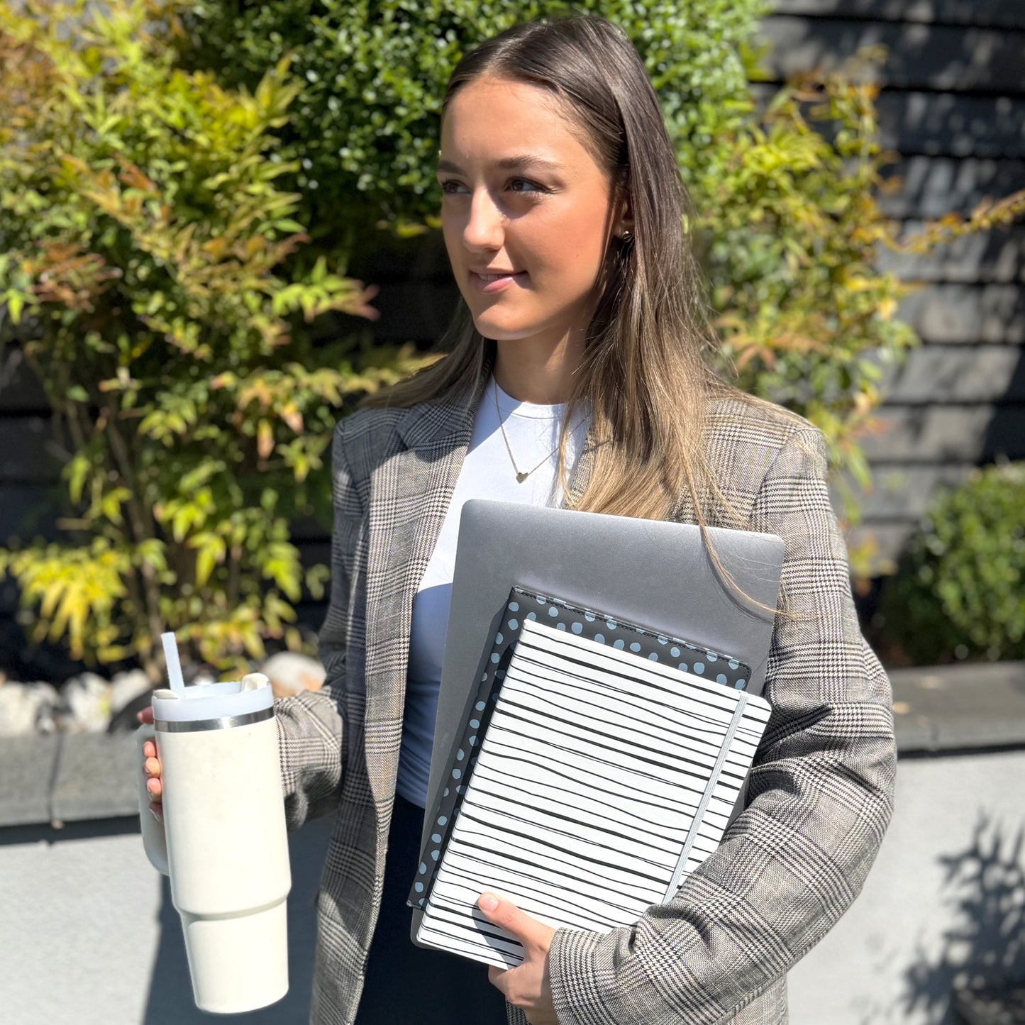 student at college with her stationary notebooks for revision and writing notes