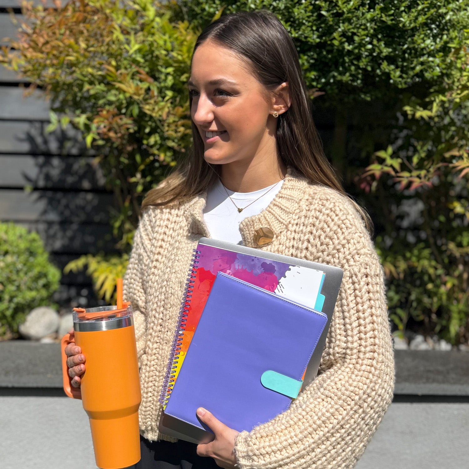 girls with stationary supplies and revision books at college 